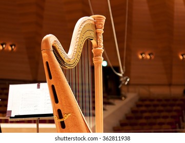 Harp In A Large Concert Hall. Musical Instrument.The Concert Harp