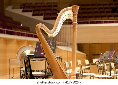 Harp In A Large Concert Hall. Musical Instrument.The Concert Harp