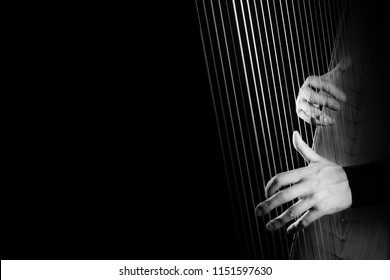 Harp Player. Harpist Hands Playing Irish Harp Strings Music Instrument Closeup