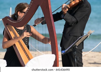 Harp And Violin Concert At The Seaside.