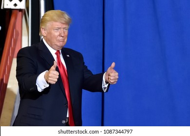 HARRISBURG, PA - APRIL 29, 2017: President Trump giving a two thumbs up  gesture as he exits the stage of his campaign rally. Held at The Farm Show Complex and Expo Center.