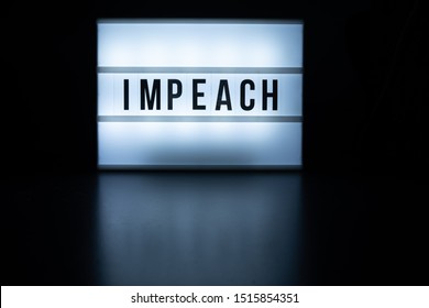 Harrisburg, PA - September 27, 2019 - Text in english on lightbox sign spelling Impeach. An impeachment inquiry against Donald Trump was initiated on September 24, 2019.