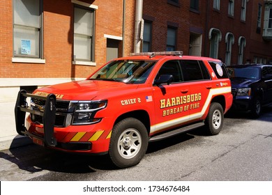 Harrisburg, PA / USA - May 15, 2020: The Harrisburg Fire Department’s Chief’s Car, Parked Along A City Street.