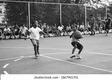 Harrisburg, Pennsylvania United States of America - July 10th 2019: two inner-city youth practice basketball against each other in a summer youth program