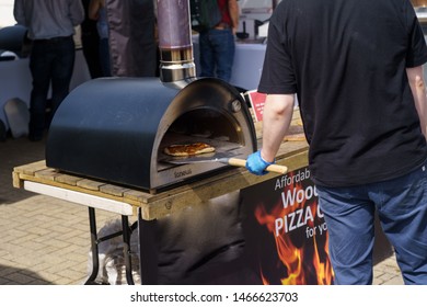 Harrogate, North Yorkshire, UK.7.10.2019.Guy Cooking A Pizza On An Outdoor Oven At The Great Yorkshire Show.