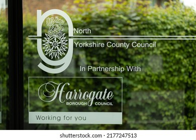 Harrogate, Yorkshire, UK 20 May 2022: Public Bus Stop Window Saying North Yorkshire Country Council In Partnership With Harrogate Borough Council