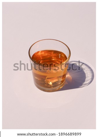 Harsh light through glasses, shadows. Clean minimalist contemporary art. Conceptual image. pastel clean colors. Pure water in glass. Simple visual concept.