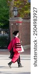 Harvard Graduation Day and a very proud graduate walking.