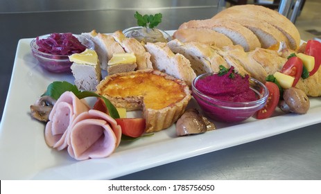 A Harvest Board; Beetroot Hummus, Onion Marmalade, Quice Lorrain, Caprese Salad, Chicken Liver Pate, Babaganosh, Ham, Pickled Mushrooms, Baguette And Ciabatta Breads.