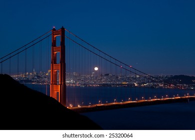 Harvest moon rises over the Goldengate Bridge