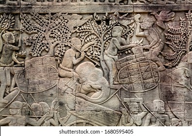 Harvest Time, Stone Faces And Elephants On The 12th Century Relief Of Bayon Temple, Cambodia. Historical Artwork On Wall Of Khmer Landmark In Angkor. UNESCO World Heritage Site.