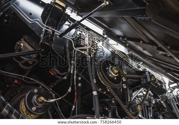 Harvester\
engine, gear chains, mechanisms transmission of new modern\
technology combine vehicle motor with metal, chrome, plastic parts,\
heavy agricultural industry equipment,\
toned