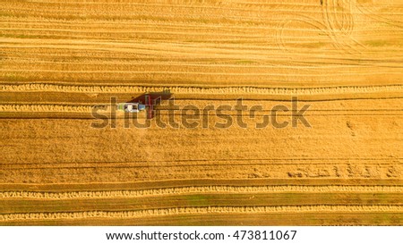 Similar – Combine harvester harvests grain field in the evening light from the air