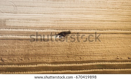 Similar – Combine harvester harvests grain field in the evening light from the air