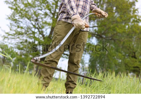 Similar – Image, Stock Photo Scythes; a man with a scythe in the garden.