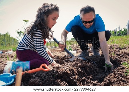 Harvesting Memories: Father and Daughter Creating a Garden Legacy through Planting