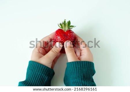 Similar – Woman holds strawberries in her hands