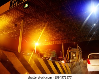 Haryana, India - December 02, 2018: Vehicle Crossing Toll Booth At Night.