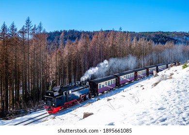 Harz national park Germany during winter at Brocken Bahn, a Famous steam train through the winter mountain. Brocken, Harz National Park Mountains in Germany Europ - Powered by Shutterstock
