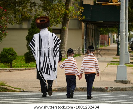 Hasidic Jews walk to temple on the sabbath in Williamsburg Brooklyn
