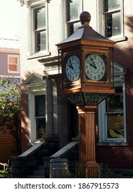 Hastings, MI, USA - September, 20, 2020: Historic Charlton Park, Details Of The Main Street Corner. Historic Standing  Street Clock With Decorations. Sunny Day, No People, Vertical.