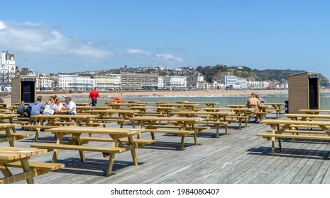 Hastings, UK - 30 May 2021: Hastings Pier Beer Garden And Bar Overlooking The Sea, Sussex