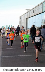 Hastings,East Sussex/UK 03-24-19 The Buckswood School Mini Run 2019. A Few Of The Participants Aged Between 7 And 16 Pass The Azur Marina Pavilion On The St Leonards On Sea Seafront