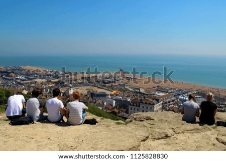 Hastings,East Sussex/UK 07/05/18 A beautiful Bank Holiday and a stunning view from the west hill, across the old town to the seafront, beach and English channel. Young people enjoy the scenery