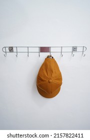 A Hat Attached To A Clothes Hook.