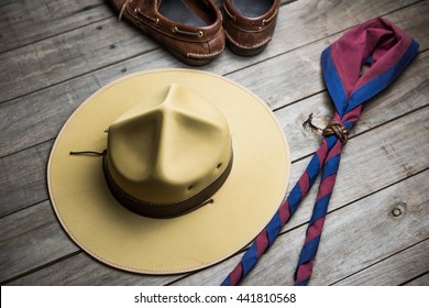 Hat Of Boy Scout And Accessories On Wooden Background