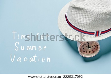 a hat, clock and the words time to summer vacation on a light blue background with copy - up text