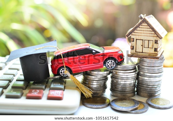 hat\
education ,car and house model on saving coins money and calculator\
need basic of life for concept loan and insurance\
