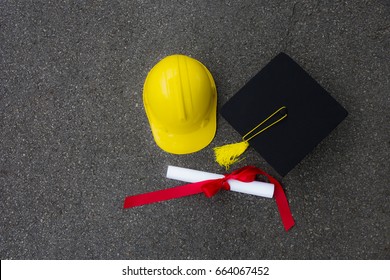 Hat and graduation certificate Put on the floor And  yellow engineer hat was put together. a Life after graduation will starting.