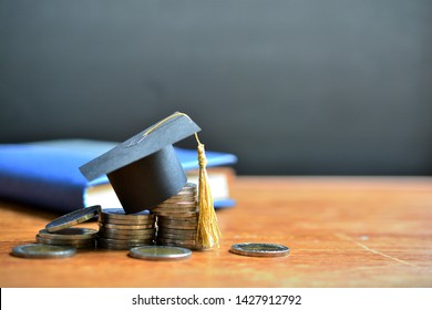 hat graduation model on money coins saving for concept investment education and scholarships - Shutterstock ID 1427912792