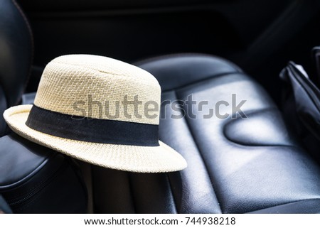 The hat is placed on the car seat.