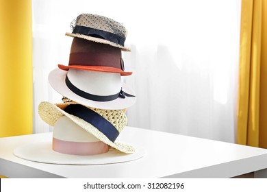 hat stack on white table in the room with copy space