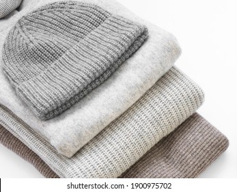 Hat And Sweaters In A Stack Of Warm Cashmere