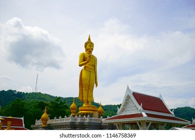 Hat Yai, Thailand – 1 May 2018: Phra Buddha Mongkol Maharaj tallest Golden Standing Buddha is located on top of a hill at Hat Yai Municipal Park.
