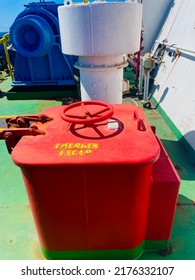 Hatch Cover Of The Emergency Escape Door On The Ship With Red Color And The Words 