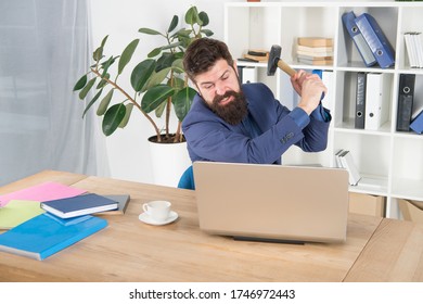 Hate My Job. Dealing With Error. Overworked Man Crush Laptop With Hammer. Frustrated Computer User. Businessman Express Anger. Ready To Smash. Office Life Makes Him Crazy. Slow Internet Connection.