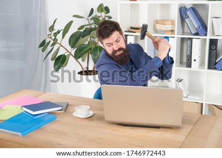 hate my job. dealing with error. overworked man crush laptop with hammer. frustrated computer user. businessman express anger. ready to smash. Office life makes him crazy. Slow internet connection.