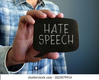 Hate Speech Concept. A Hand Holds A Black Plate.