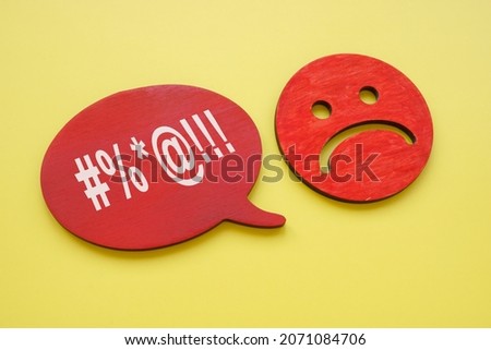 Hate speech or rudeness concept. Unhappy face and quote bubble.