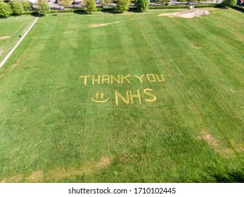 Hatfield, England - April 19th 2020: NHS Tribute Saying 'Thank You NHS' Mowed Into Playing Field