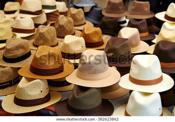 Hats in outdoor store\
stacked in a row