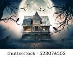 Haunted House with Full Moon in the Background. Haunted House Scene.
