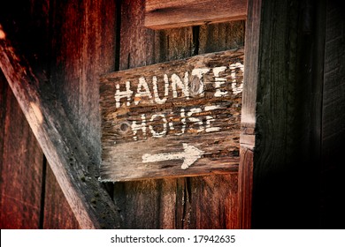 Haunted House Sign On Old Wooden Building