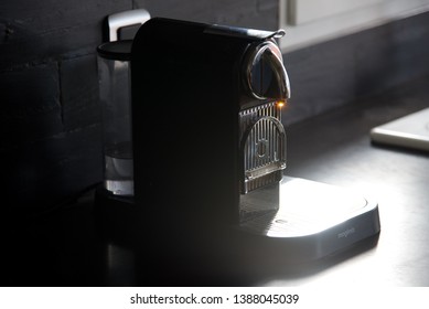 Hauts-de-France/France-March 19 2019: A Sun-struck Bead Of Coffee On The Nozzle Of A Magimix Nesspresso Citiz & Milk Coffee Machine