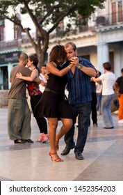 HAVAMA / CUBA - 03.16.2015: Young Couples Dancing Salsa On Street Of Paseo De Marti, La Habana Vieja, Havana