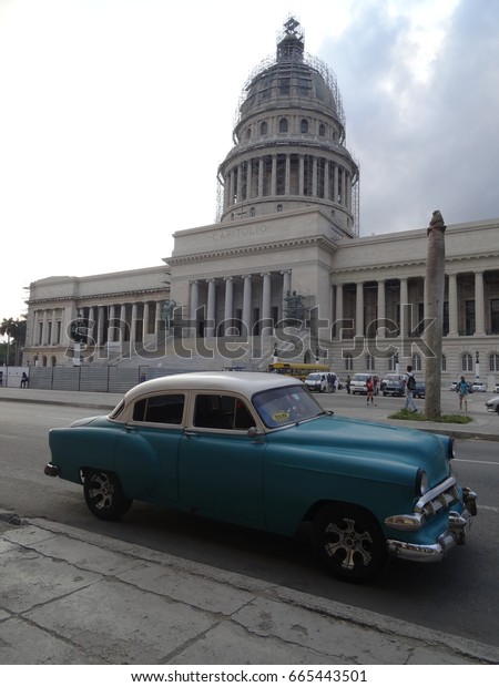 Havana 02.02.2017: Tourists enjoying a ride in a
classic car on the streets of Havana,Cuba outside the Capitol
building